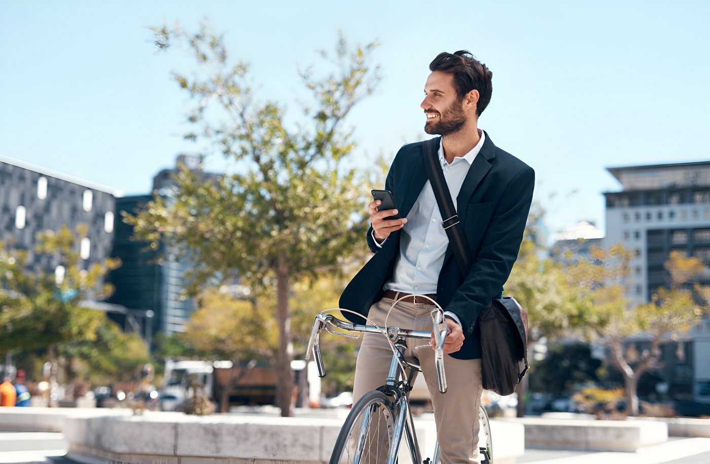 Man riding on a bike through a calm city street